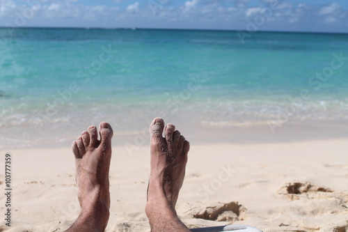 Vacation holidays. Men feet closeup   