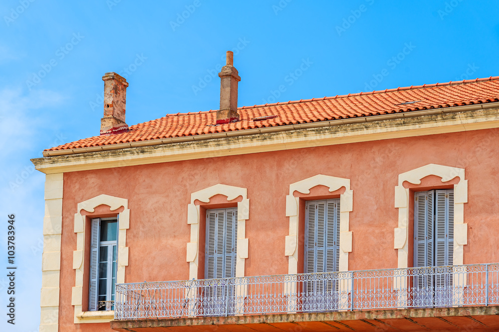 Facade of typical French house in Calvi port, Corsica island, France
