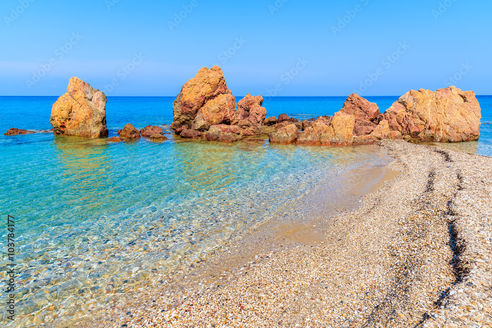 Rocks on idyllic Potami beach with turquoise crystal clear water, Samos island, Greece Rocks on idyllic Potami beach with turquoise crystal clear water, Samos island, Greece