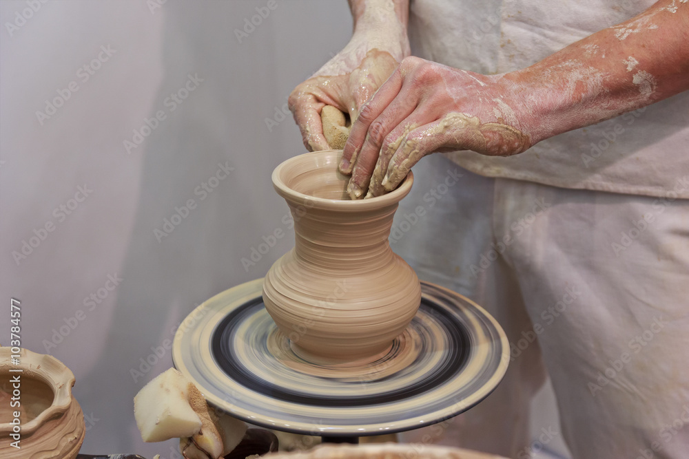 Hands of a potter making jug. Professions Hands of a potter making jug. Professions