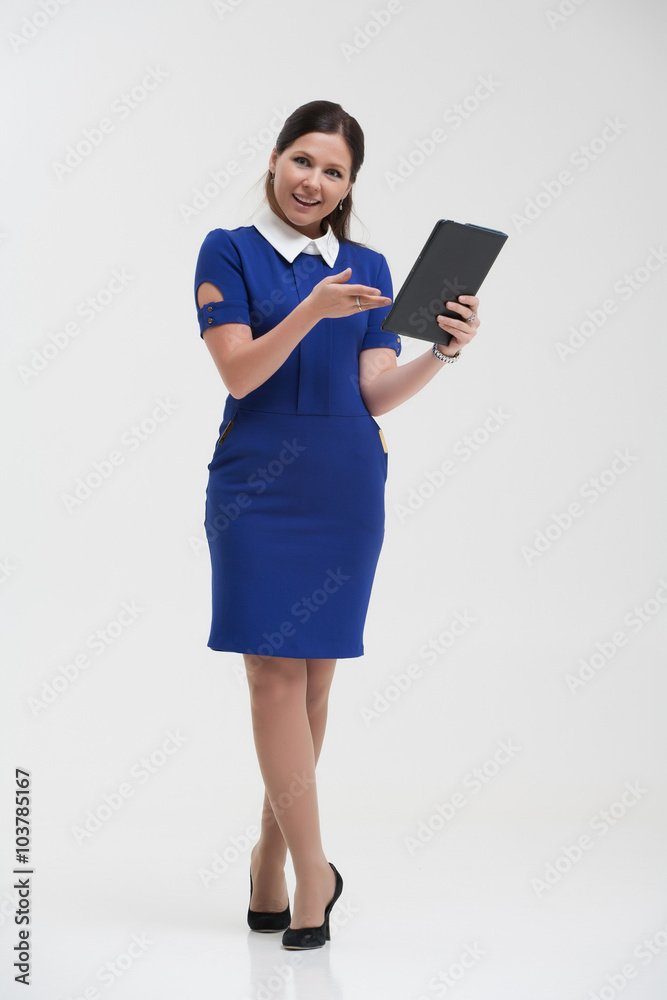 Girl in a blue suit. Keep a folder in his hands. Girl in a blue suit. Keep a folder in his hands.
