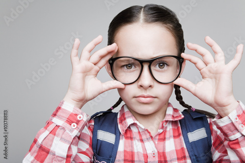 Schoolgirl in glasses.