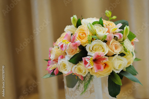 Beautiful bride bouquet for wedding day on color background