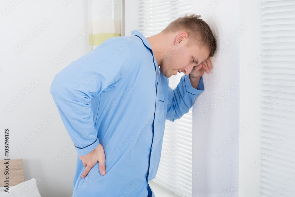 Fototapeta premium Young Man Suffering From Back Ache