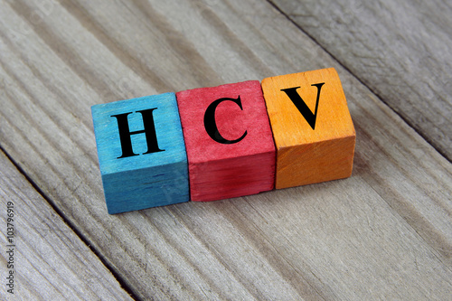 HCV (Hepatitis C virus) acronym on colorful wooden cubes photo