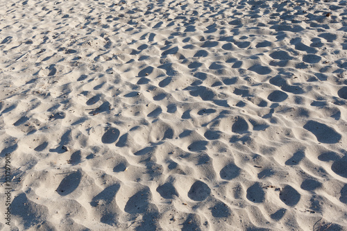 Textured tropical beach sand background.