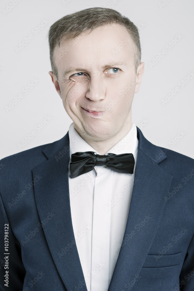 Portrait of Caucasian Handsome Man in Blue Suite Making Faces. Portrait of Caucasian Handsome Man in Blue Suite Making Faces.