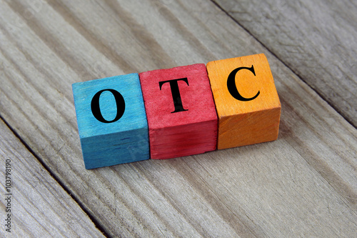 OTC (Over The Counter) acronym on colorful wooden cubes photo