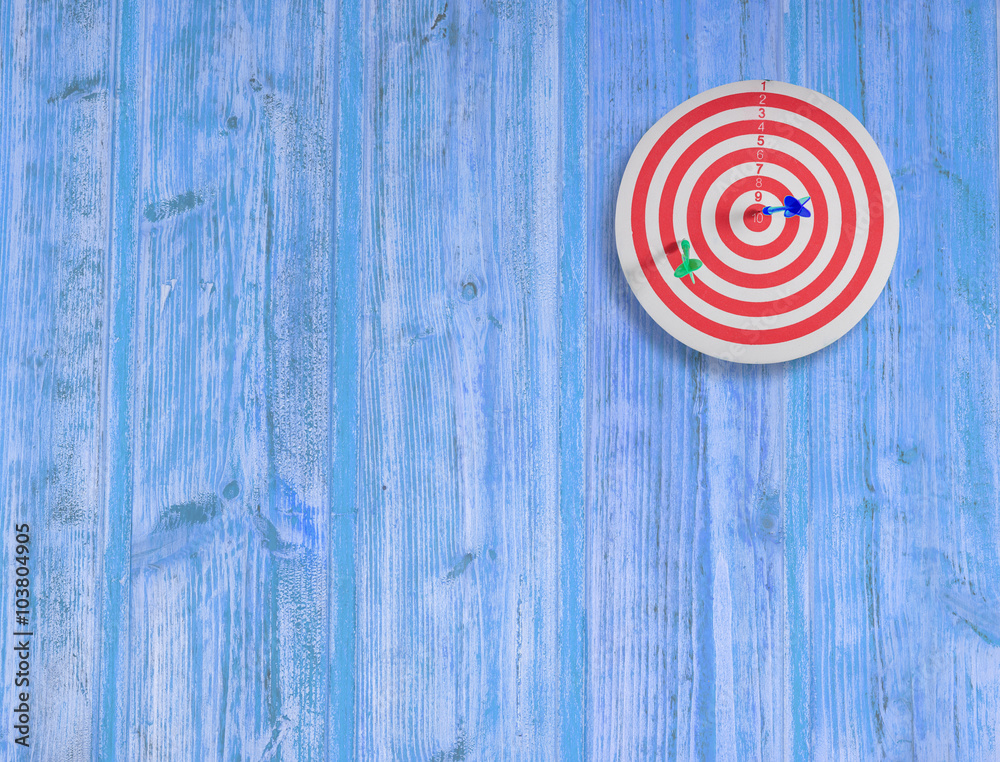 dart target on color wood wall dart target on color wood wall