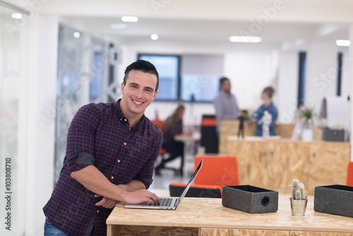 startup business, young man portrait at modern office