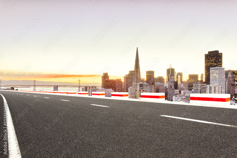 asphalt road with cityscape of San Francisco and skyline