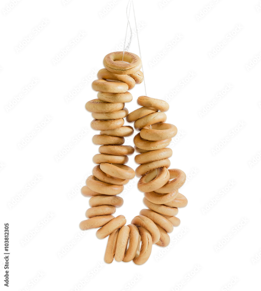 Hanging a bunch of bagels on a light background Hanging a bunch of bagels on a light background