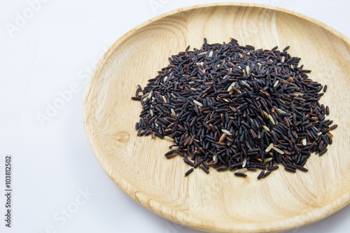 Rice berry in wooden bowls on white background. concept