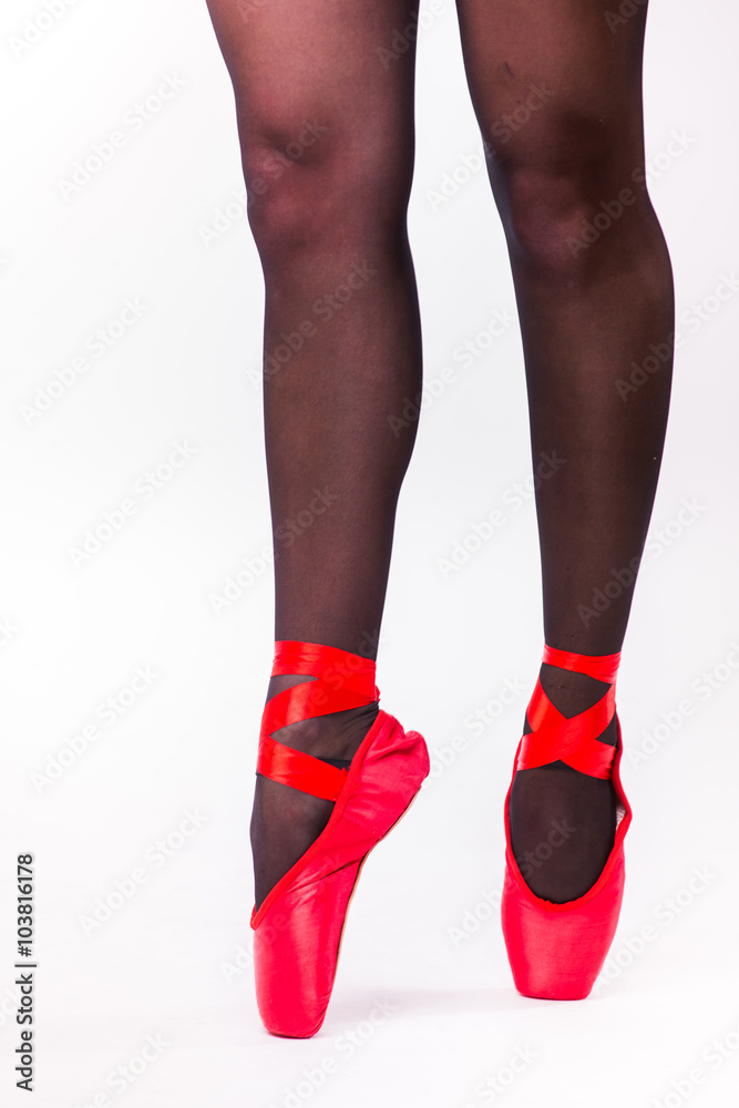 Feet close up of ballerina isolated on white background. Feet close up of ballerina isolated on white background.