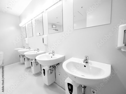 a clean new public toilet room empty © flucas