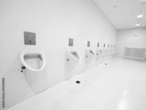 a clean new public toilet room empty