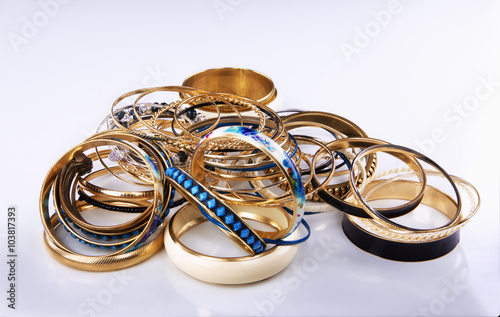 Lots of various golden bracelets