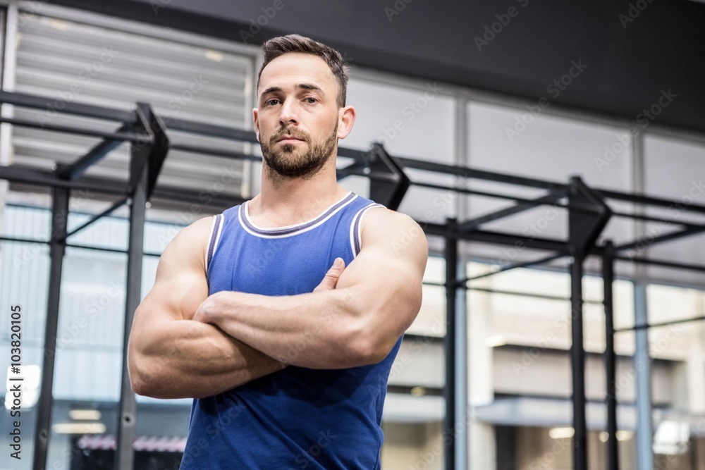 Determined man standing with arms crossed Determined man standing with arms crossed