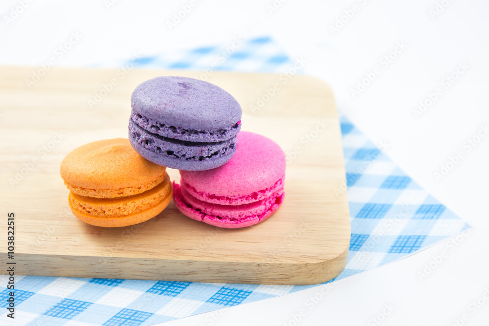 Colorful macaroons variety closeup on wood. concept resentation Colorful macaroons variety closeup on wood. concept resentation