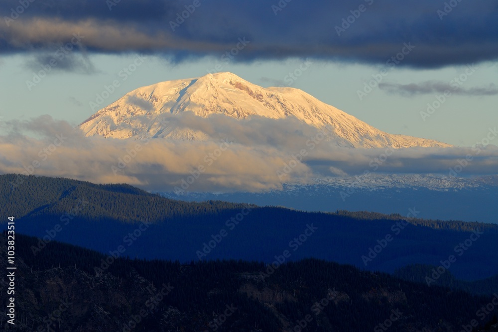 Sunset views from the Windy Ridge to Mount Adams in clouds. US Pacific Northwest, Washington.