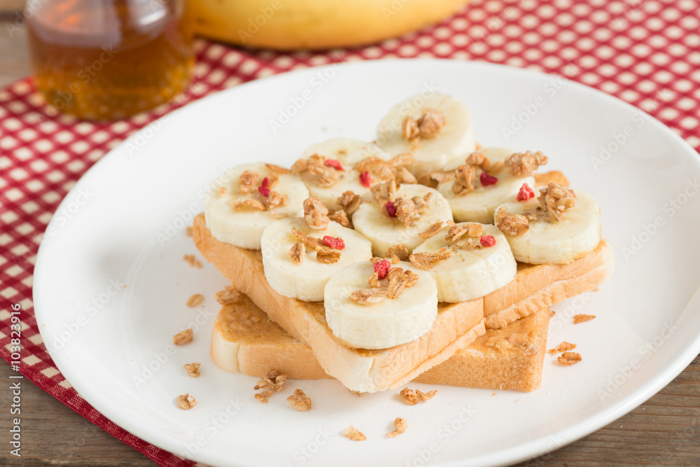 A healthy peanut butter and banana sandwich, muesli crisp with berry. A healthy peanut butter and banana sandwich, muesli crisp with berry.