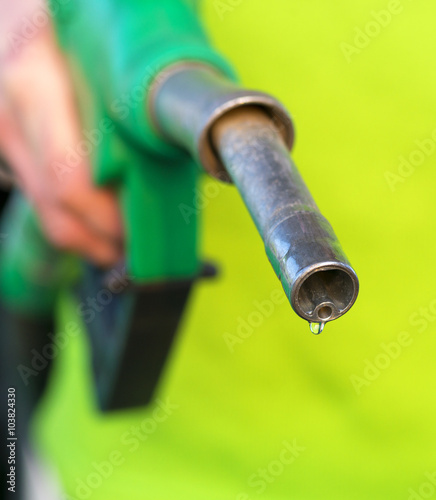 Male hand holding green pump