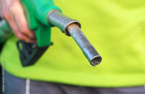 Male hand holding green pump