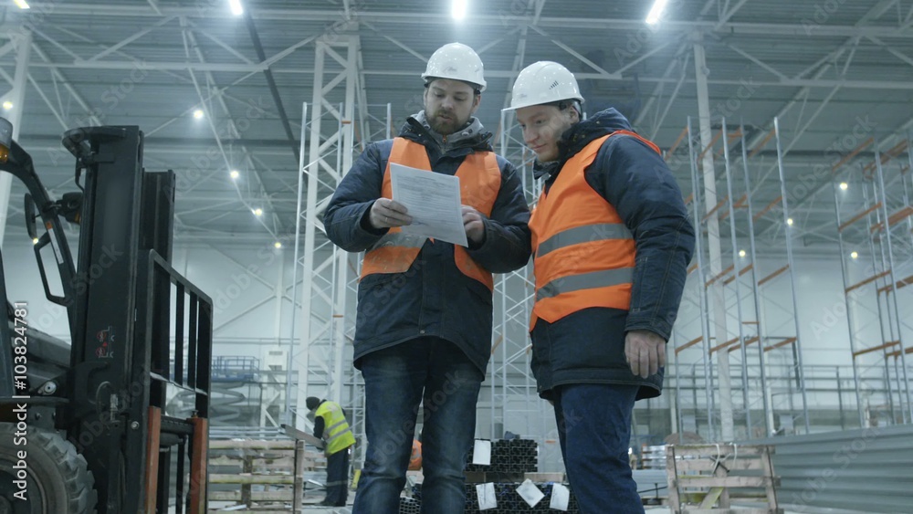 Engineers giving Handshake in new modern industry warehouse Engineers giving Handshake in new modern industry warehouse
