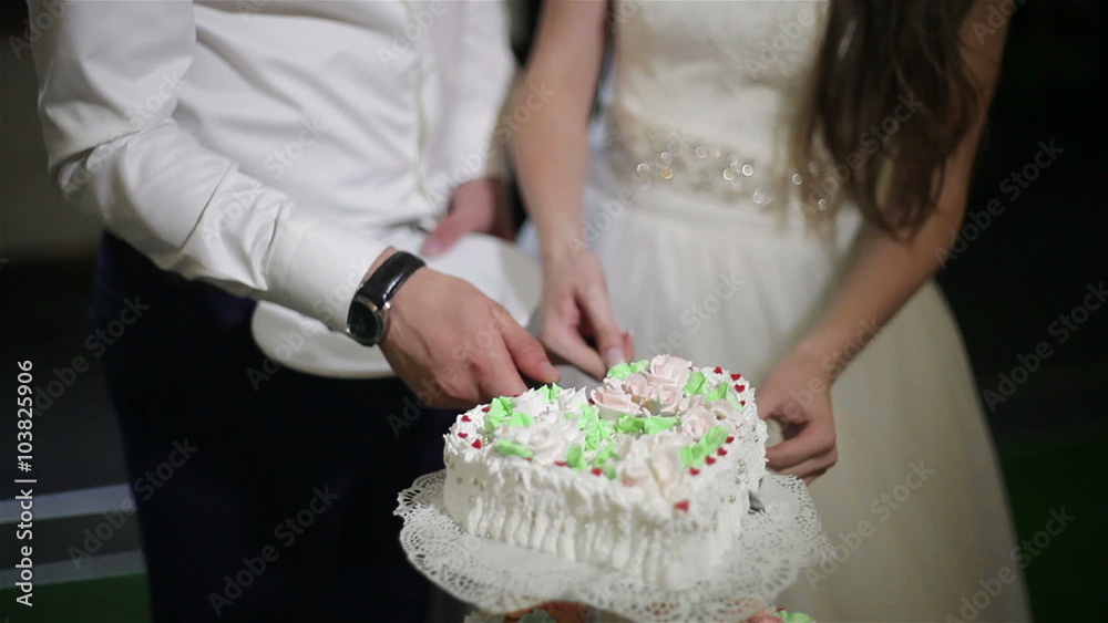 The Bride And Groom Cut The Wedding Cake The Bride And Groom Cut The Wedding Cake