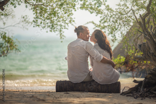 Happy couple on sand beach of Thailand