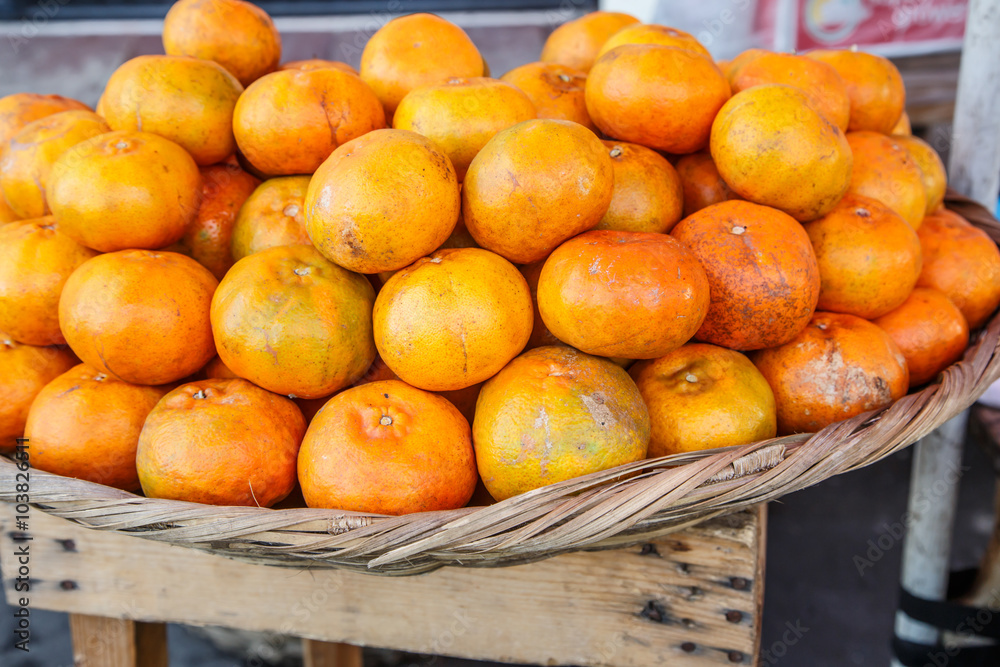 fresh mandarin group on basket from market