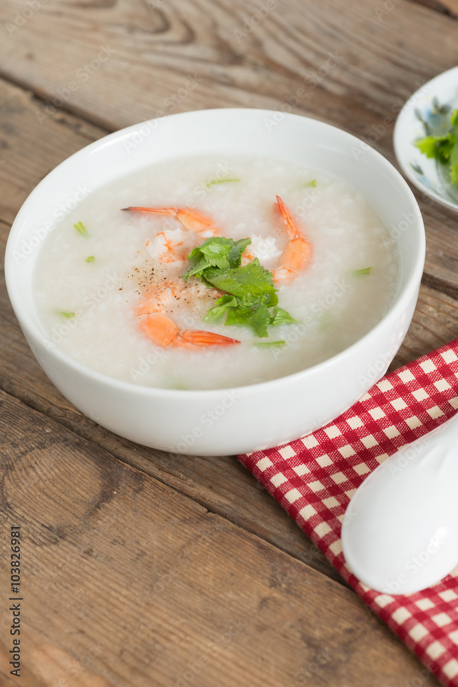 Rice porridge with shrimp in white bowl. Rice porridge with shrimp in white bowl.