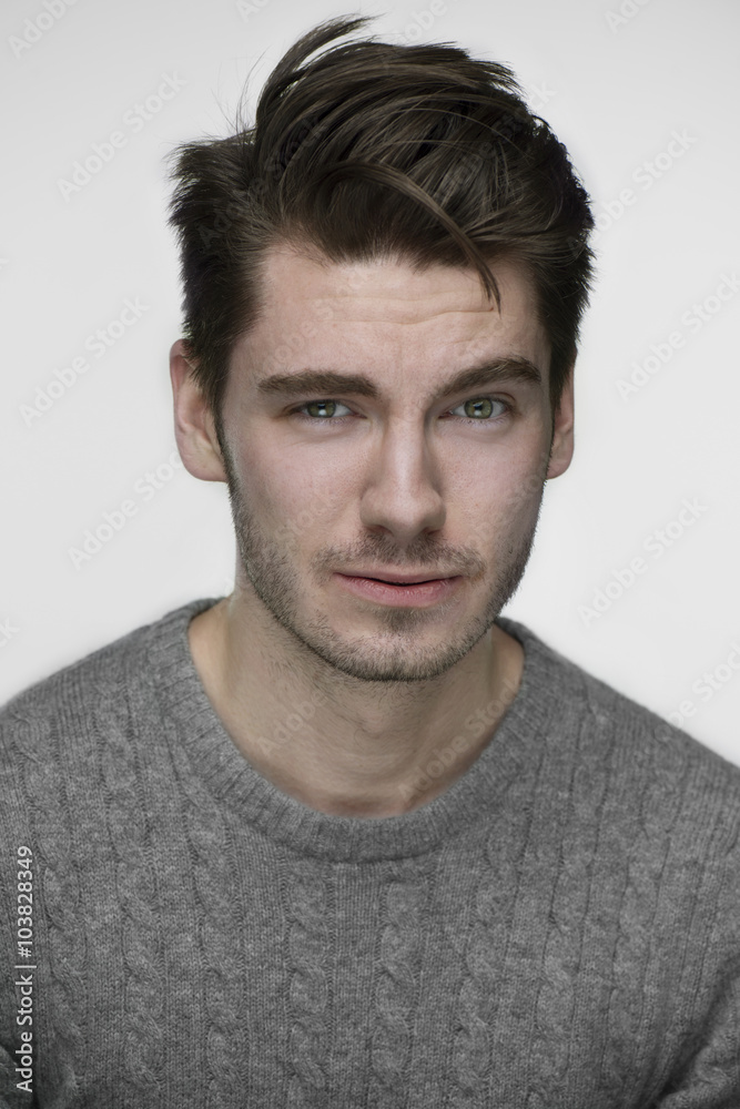 Young handsome guy portrait in front of white background Young handsome guy portrait in front of white background