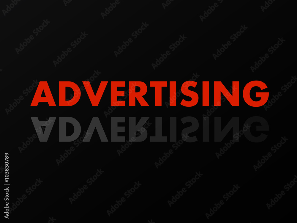 The word ADVERTISING in mirror reflection on black background