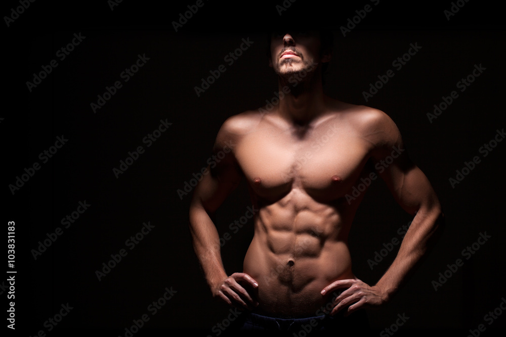 Fototapeta premium Muscular man with dark background