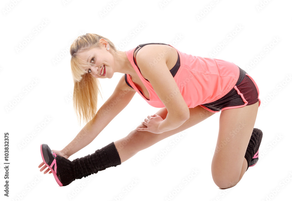 Fit woman stretching her leg to warm up Fit woman stretching her leg to warm up