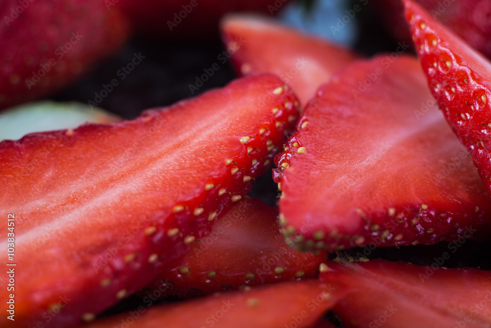Strawberry slice on a table background.Close up top view of sliced pieces of strawberries arranged on a table background.Healthy Food.Fruits Strawberry slice on a table background.Close up top view of sliced pieces of strawberries arranged on a table background.Healthy Food.Fruits