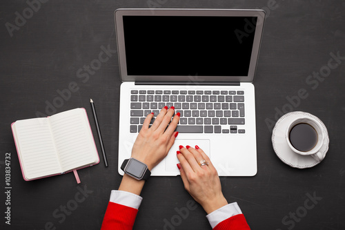 Woman working on laptop at the office 