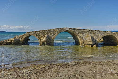 medieval bridge in the water at Argassi beach, Zakynthos island, Greece