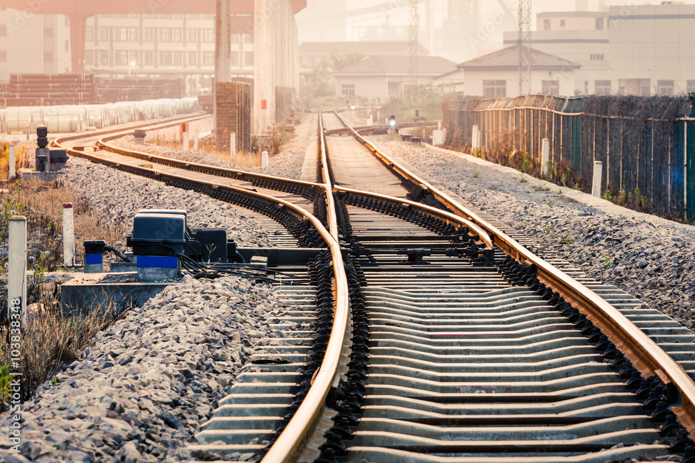 Fototapeta premium Industrial railway track at dusk