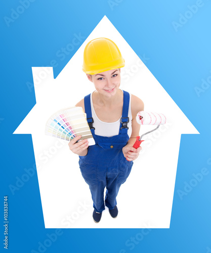 young woman painter in workwear with colorful palette and paintb photo