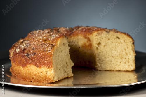 Walnuts bundt cake on a metal round tray