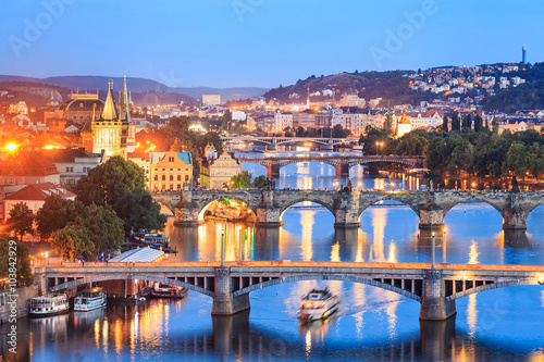 Canvas-taulu View at The Charles Bridge and Vltava river in Prague in dusk