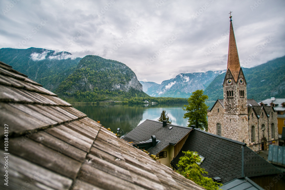Landscape Hallstatt in Austria with old houses and a view of the Alps