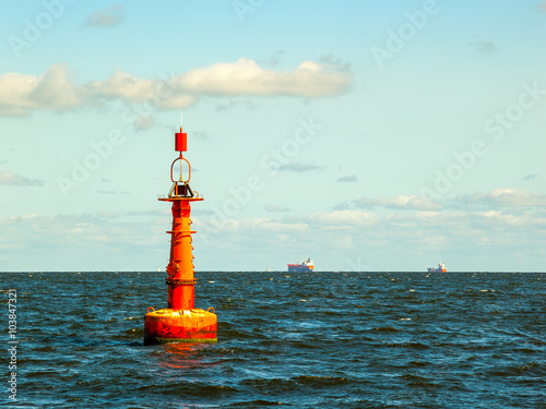 Navigation buoy at the edge of a fairway. photo
