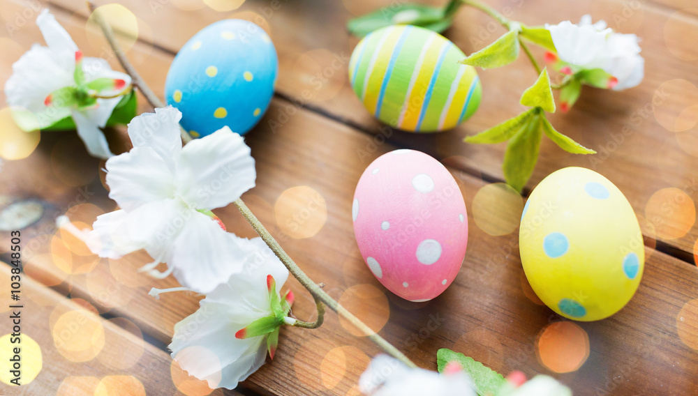 Fototapeta premium close up of colored easter eggs and flowers