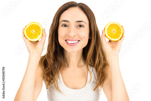 Woman showing orange halves