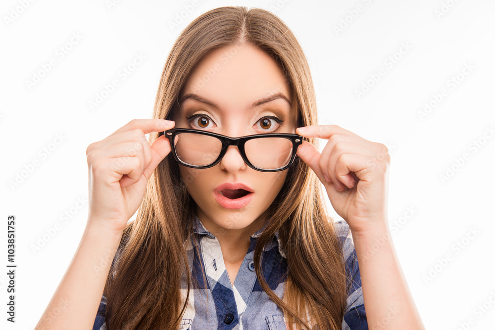 Surprised pretty girl taking off her glasses, close up photo Surprised pretty girl taking off her glasses, close up photo