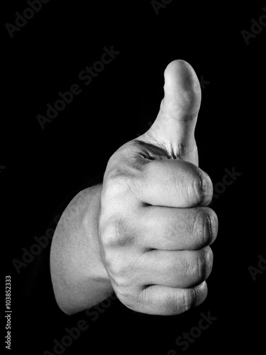 Male hand sign with thumb up. Isolated concept photo