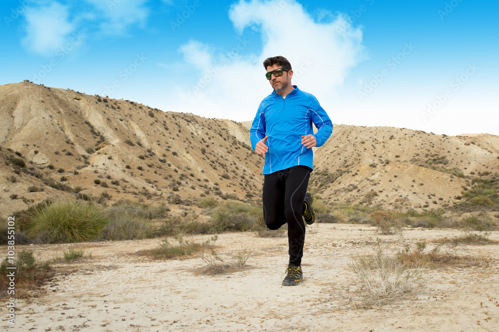 sport man running on dry desert landscape in fitness healthy lifestyle